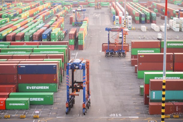 Stacking cranes in the port of Tacoma eliminate the need for trucks and forklifts, taking containers straight from where the cranes discharge them to their designated storage area in the terminal.
