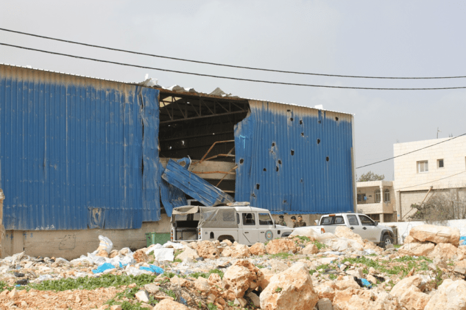 Warehouse in Bethlehem hit by helicopter gunship fire in the last Intifada, photo by JC-S, 2011